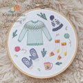 he Wooliest Season embroidery kit by Knitted Bliss — cozy winter design preprinted on 100% cotton with bamboo hoop. Canadian-made.

