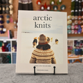 Arctic Knits book by Weichien Chan — jumpers, socks, hats and mittens — cover showing colourwork knitted jumper and Arctic landscape