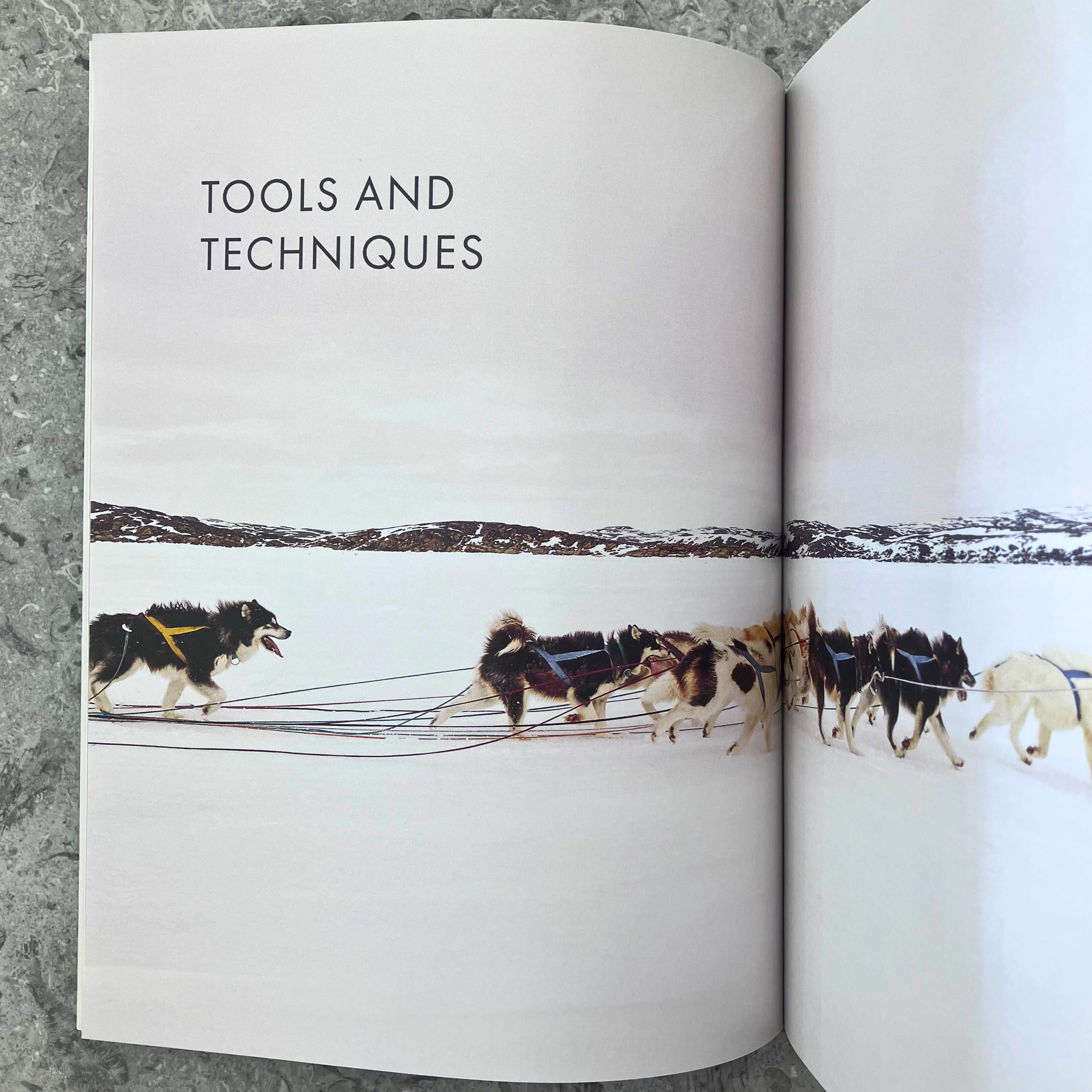 Arctic Knits by Weichien Chan — interior spread showing a page titled 'Tools and Techniques' with image of dogsledding and Arctic landscape. 