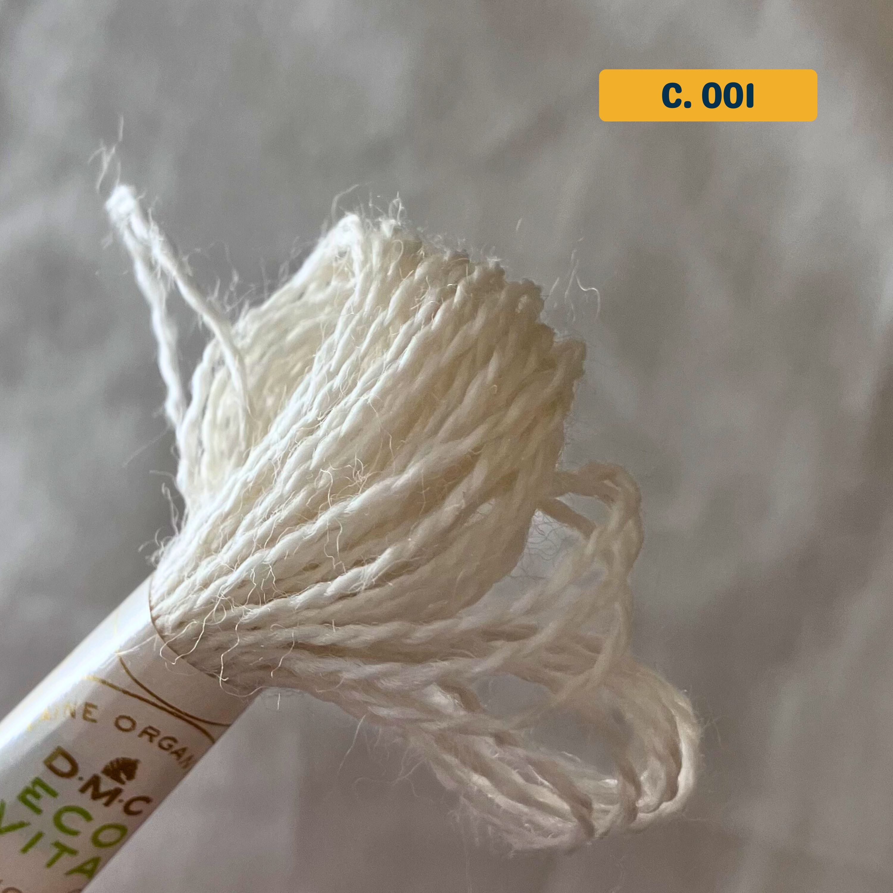 100% Organic Wool Thread — natural white (001). Naturally-Dyed. 16m. 'Organic DMC ECO VITA' label visible. 