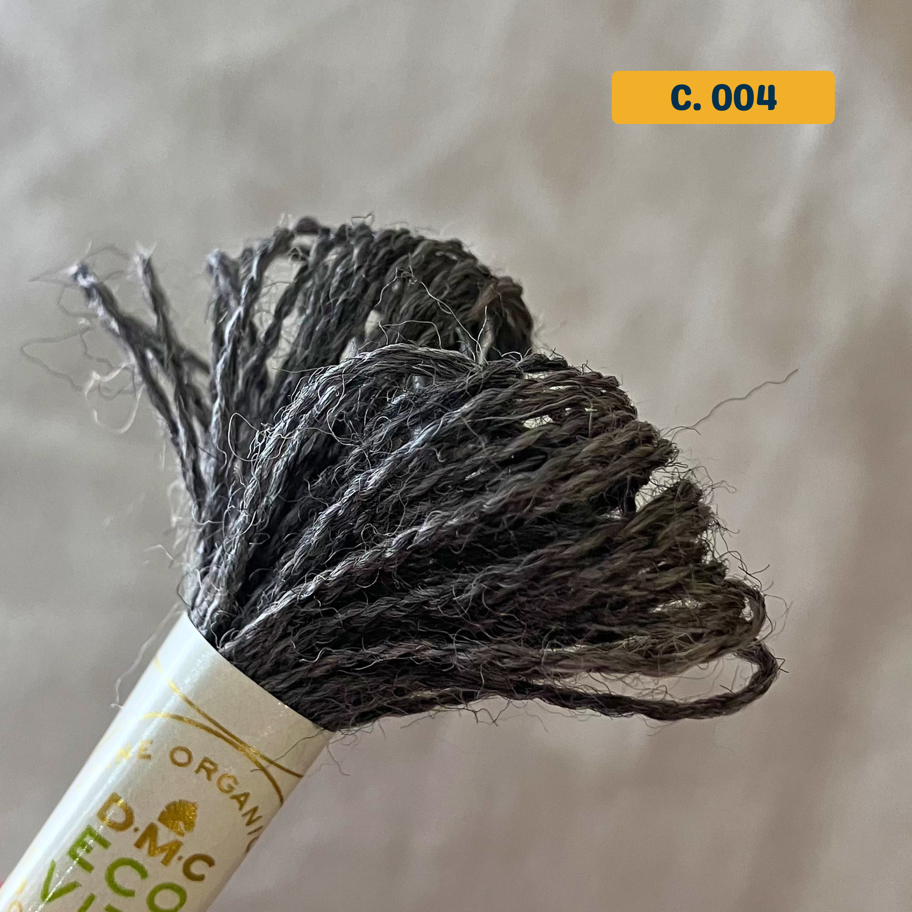 100% Organic Wool Thread — natural dark grey (004). Naturally-Dyed. 16m. 'Organic DMC ECO VITA' label visible. 