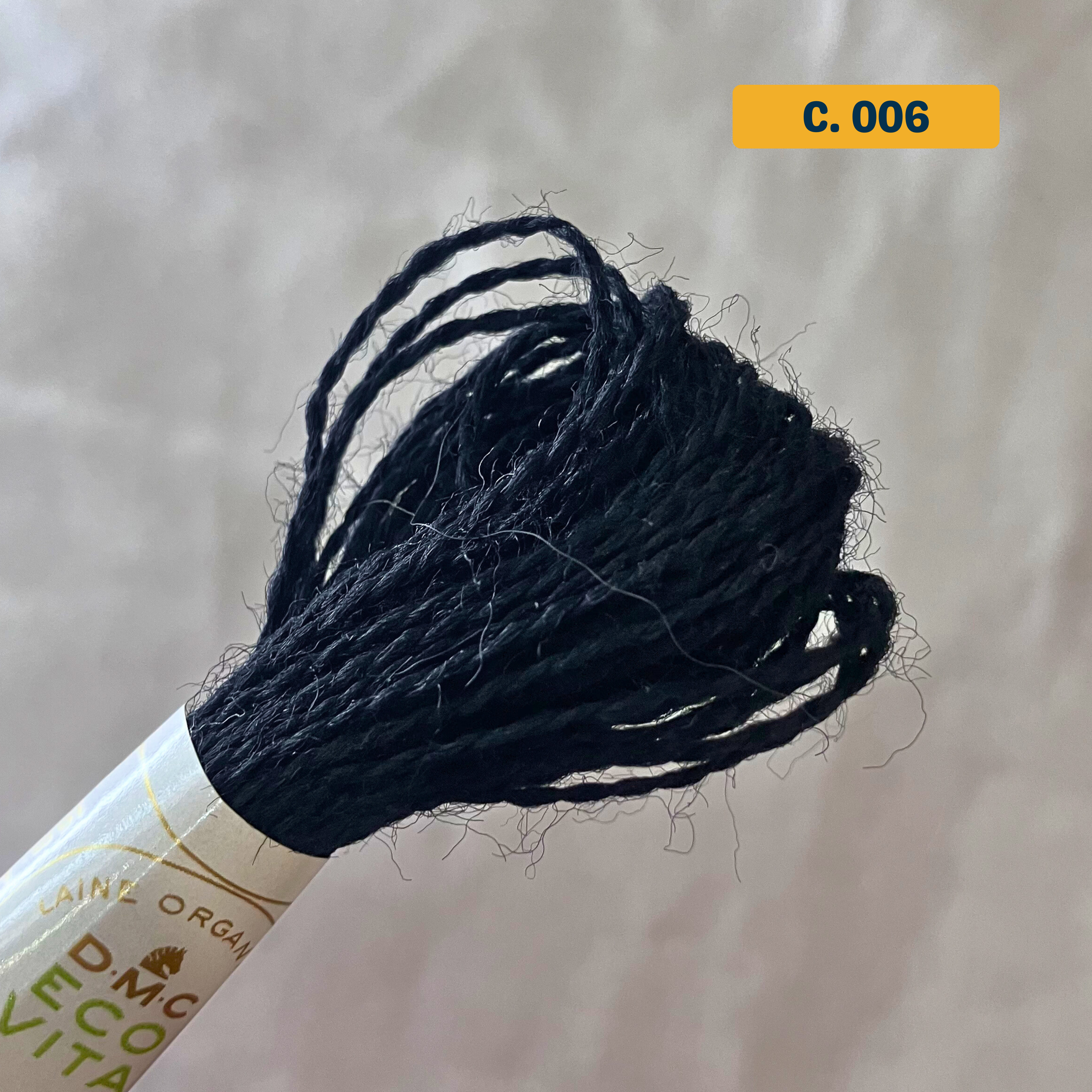 100% Organic Wool Thread — natural black (006). Naturally-Dyed. 16m. 'Organic DMC ECO VITA' label visible. 