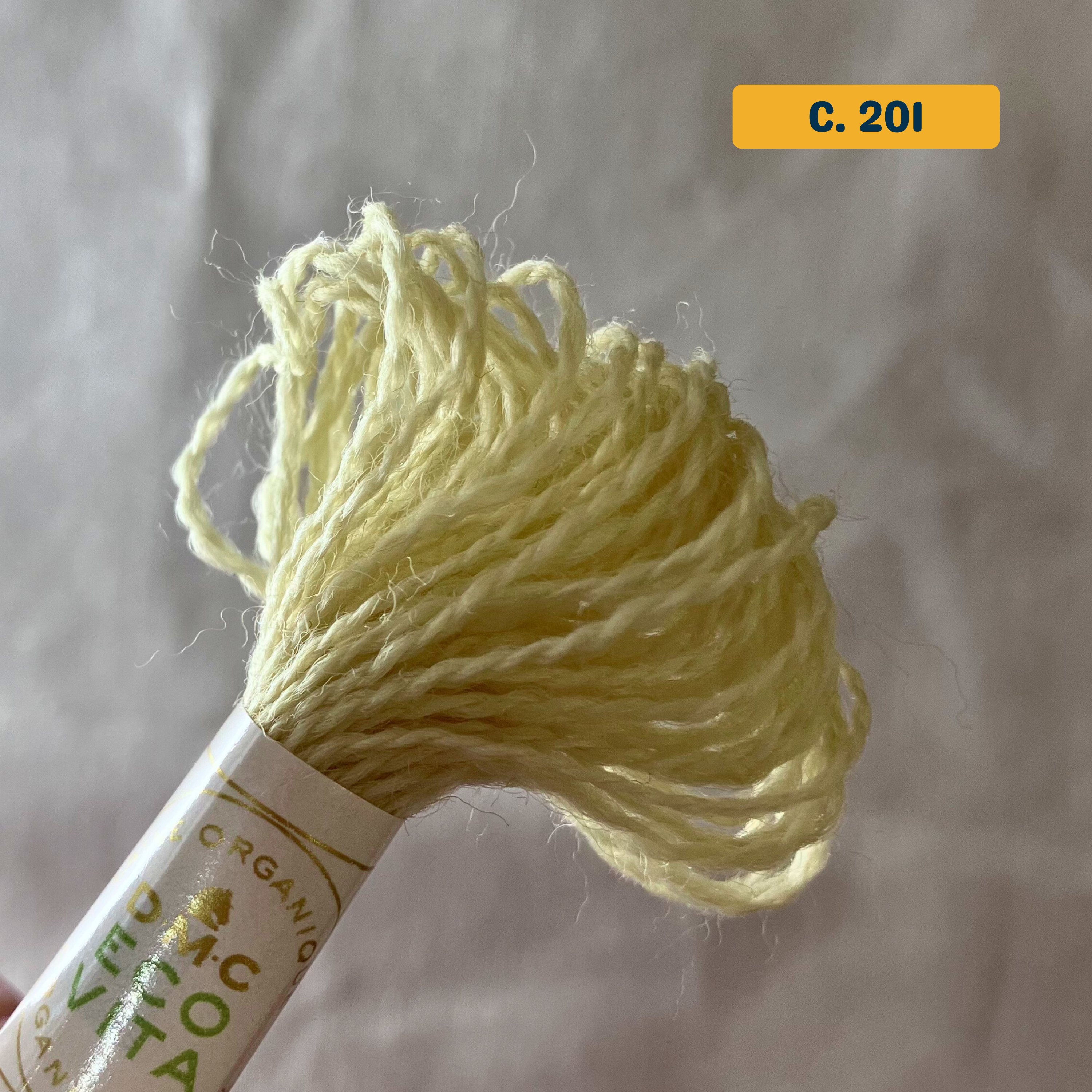 100% Organic Wool Thread — pale yellow (201). Naturally-Dyed. 16m. 'Organic DMC ECO VITA' label visible. 
