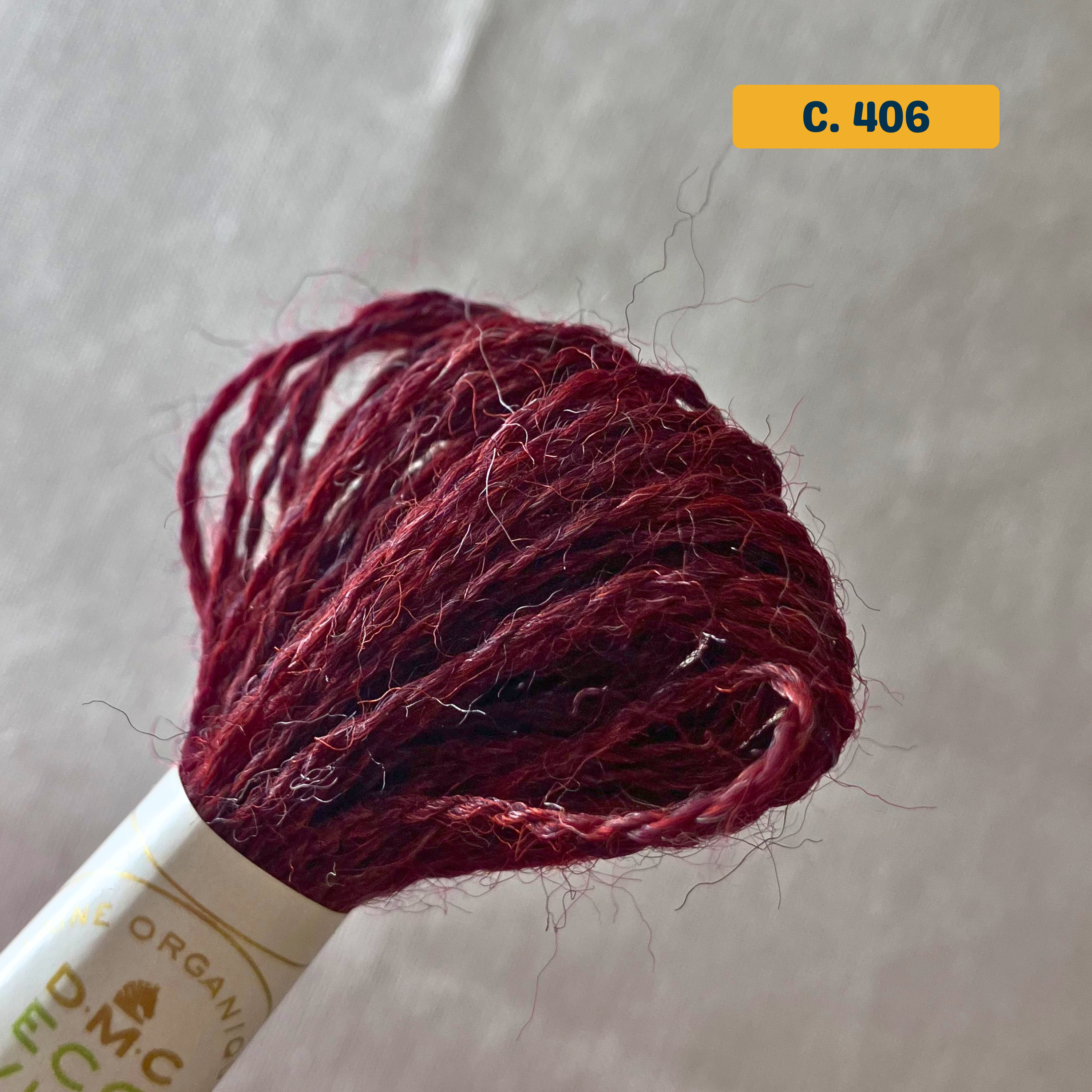 100% Organic Wool Thread — dark red (406). Naturally-Dyed. 16m. 'Organic DMC ECO VITA' label visible. 