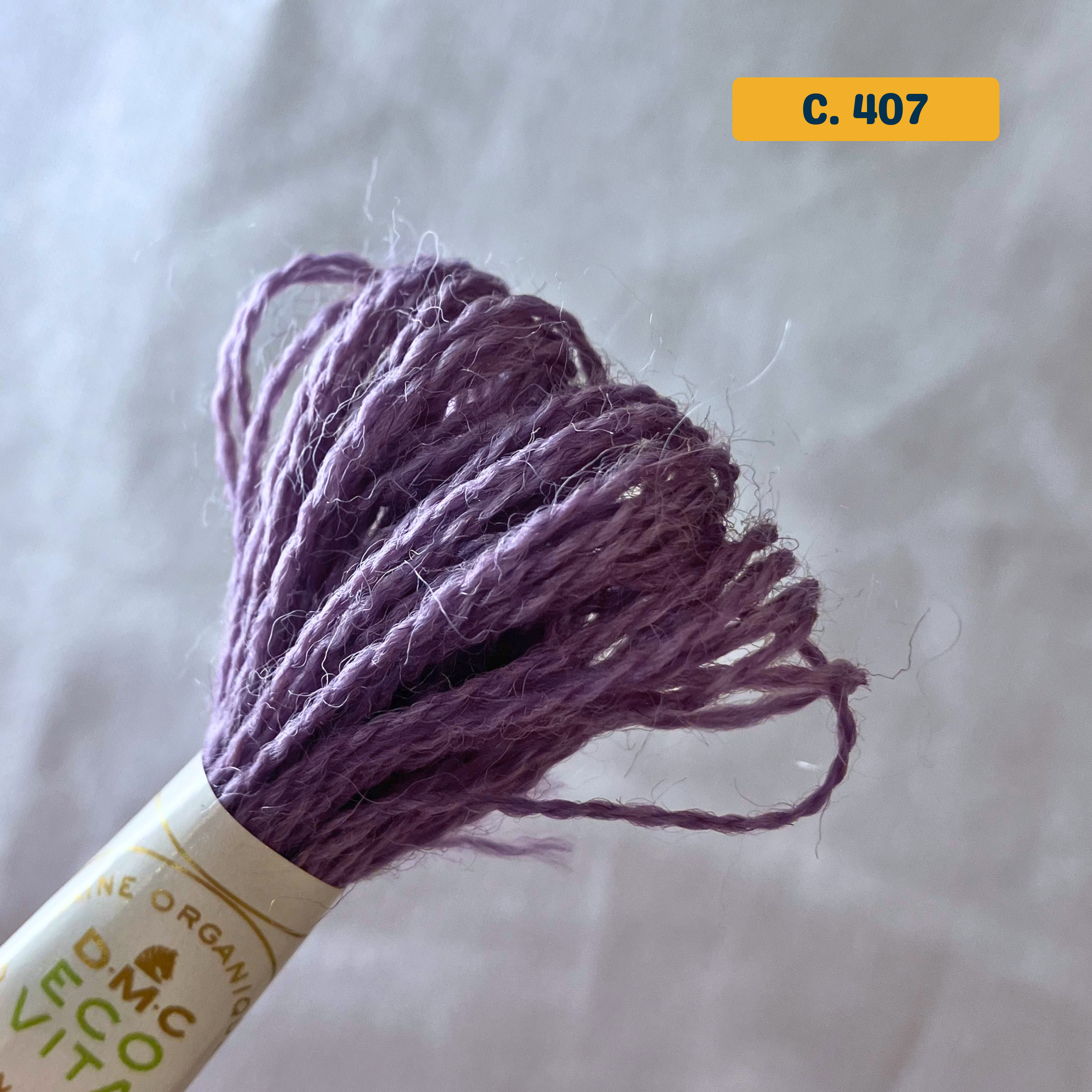 100% Organic Wool Thread — lilac (407). Naturally-Dyed. 16m. 'Organic DMC ECO VITA' label visible. 