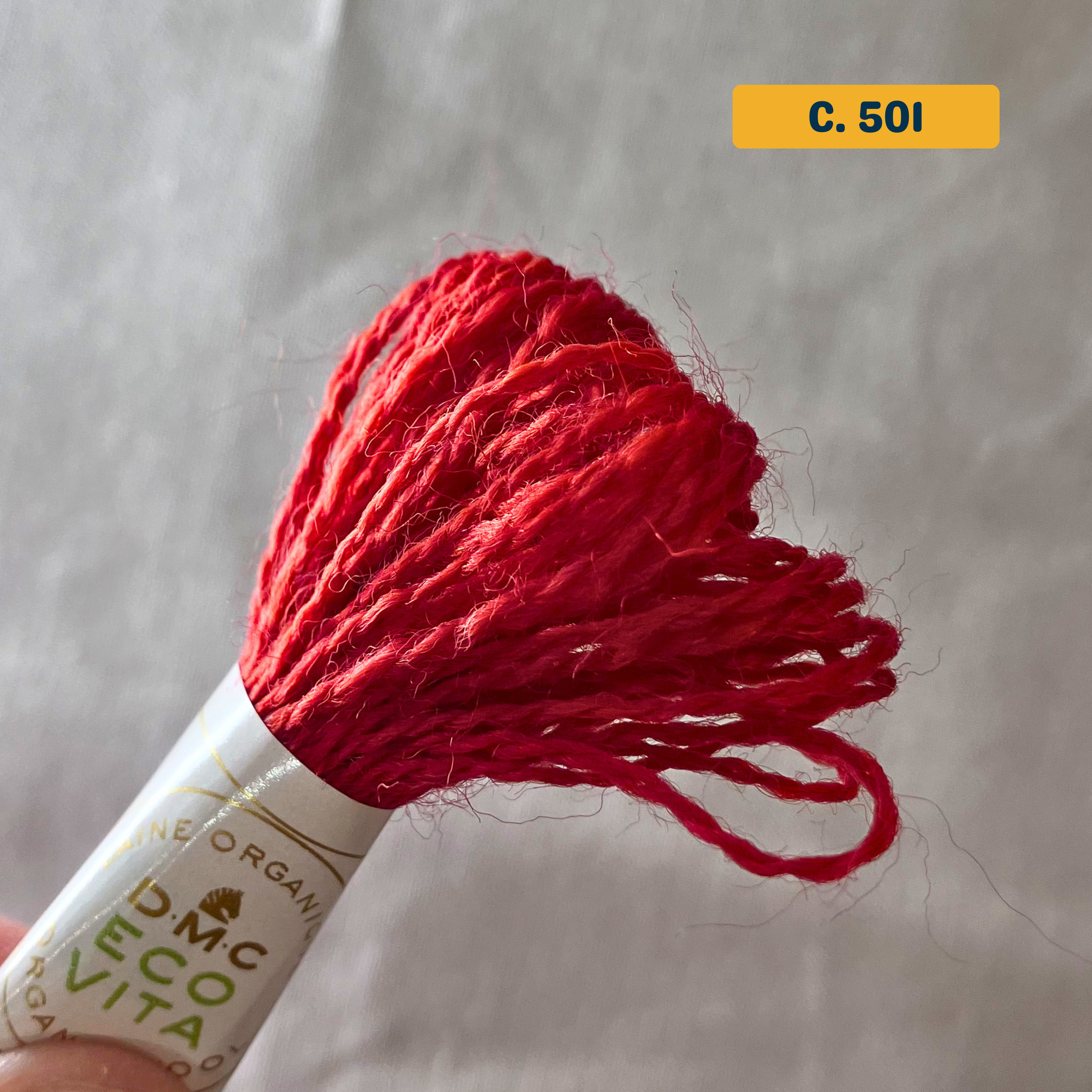 100% Organic Wool Thread — bright red (501). Naturally-Dyed. 16m. 'Organic DMC ECO VITA' label visible.