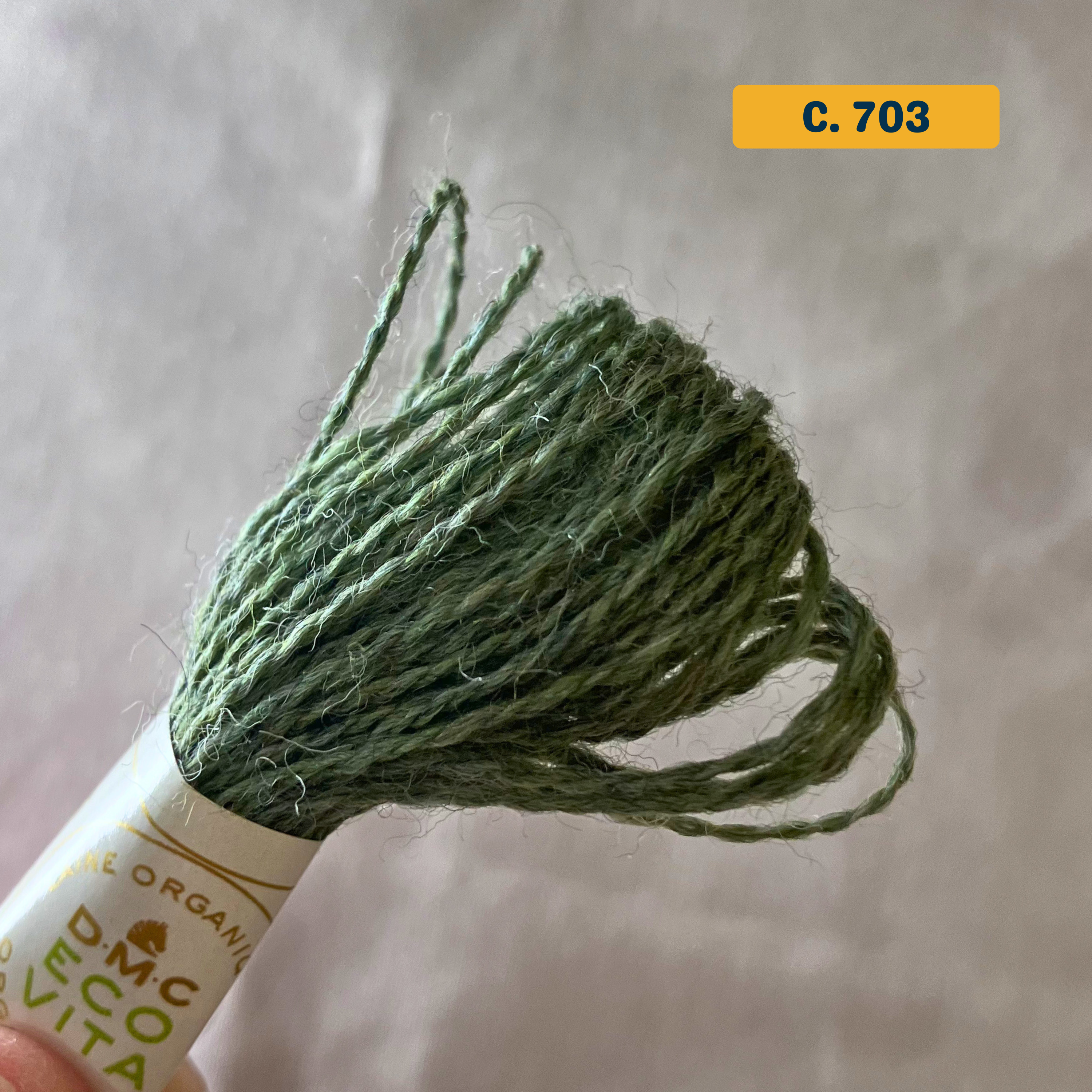 100% Organic Wool Thread — green (703). Naturally-Dyed. 16m. 'Organic DMC ECO VITA' label visible. 