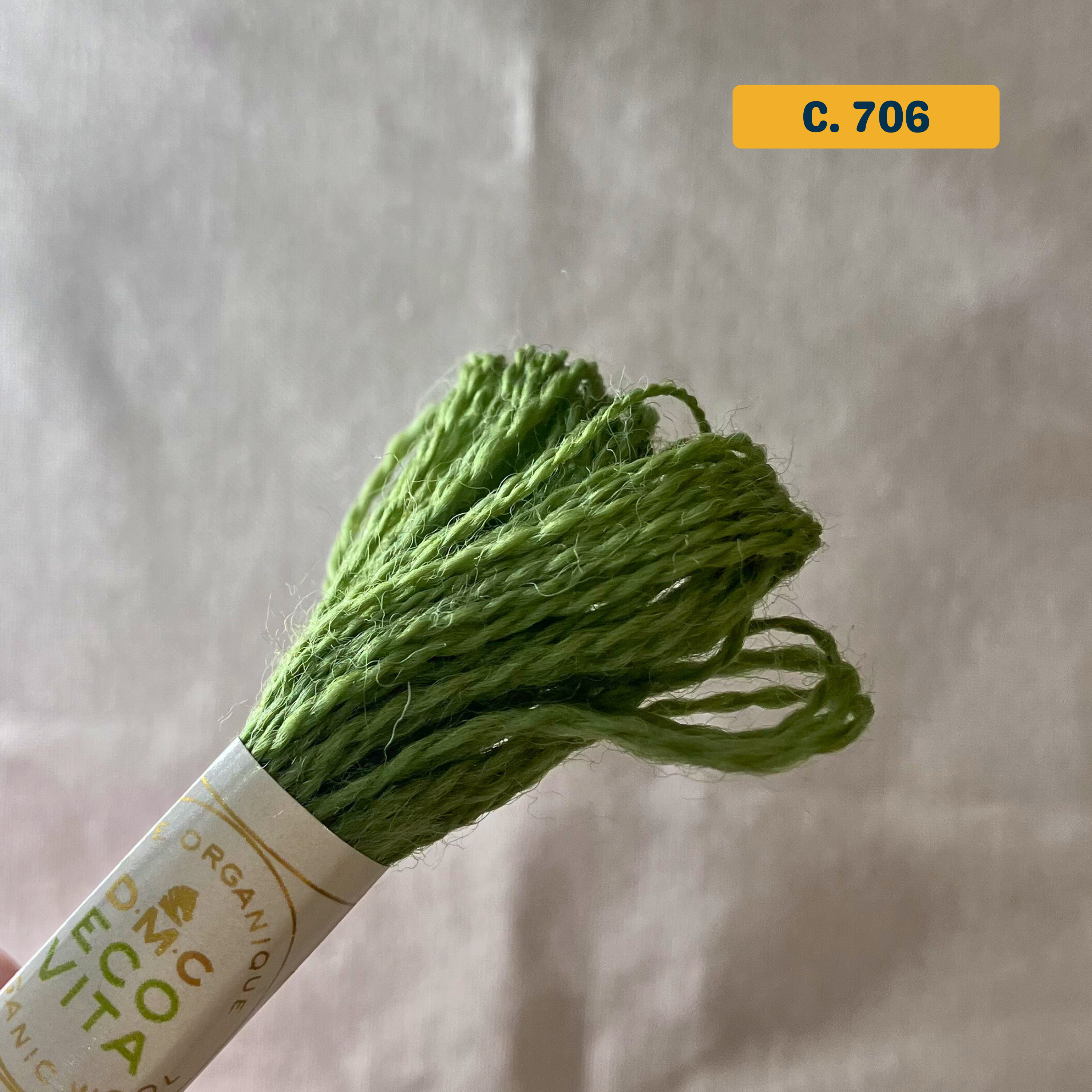 100% Organic Wool Thread — bright green (706). Naturally-Dyed. 16m. 'Organic DMC ECO VITA' label visible. 
