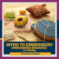 Embroidery hoop and thread kit included in the Intro to Embroidery class.
Promotional graphic for an introductory embroidery course focused on embroidered brooches with Kesley. Styled flat-lay image of embroidery supplies, including a embroidery hoop, white floss, a yellow and blue sunflower-shaped brooch, a green bobbin, and a red-and-white patterned pin-cushion piece.