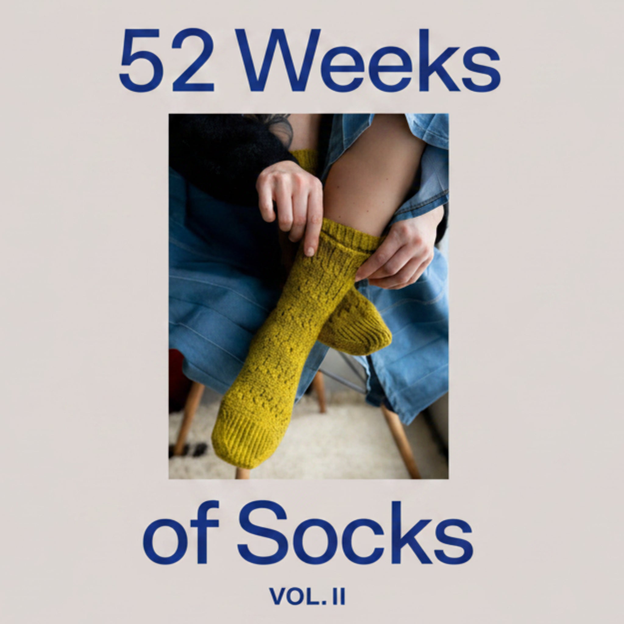 Book cover of '52 Weeks of Socks Vol. II' by Laine Publishing with a person wearing texture hand-knit socks.