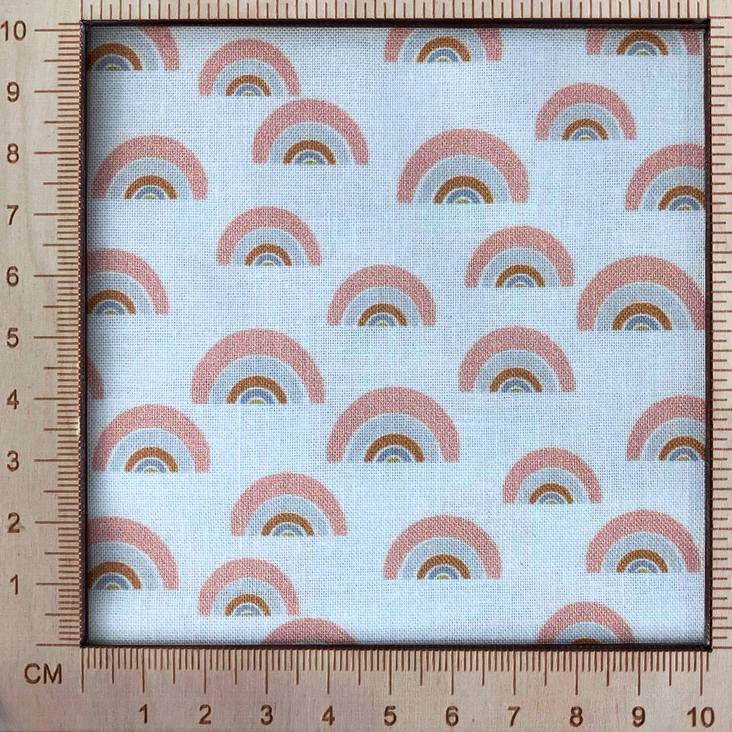 4inx4in scale — 100% cotton quilting fabric — gold, grey & salmon rainbow pattern on a white background. 44/45in width.