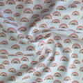 100% cotton quilting fabric — gold, grey & salmon rainbow pattern on a white background. 44/45in width.