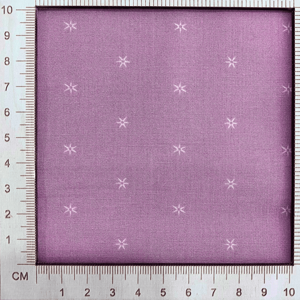4"x4" scale — 100% cotton quilting fabric — small stars on light grey-pink fabric. 44/45in width.
