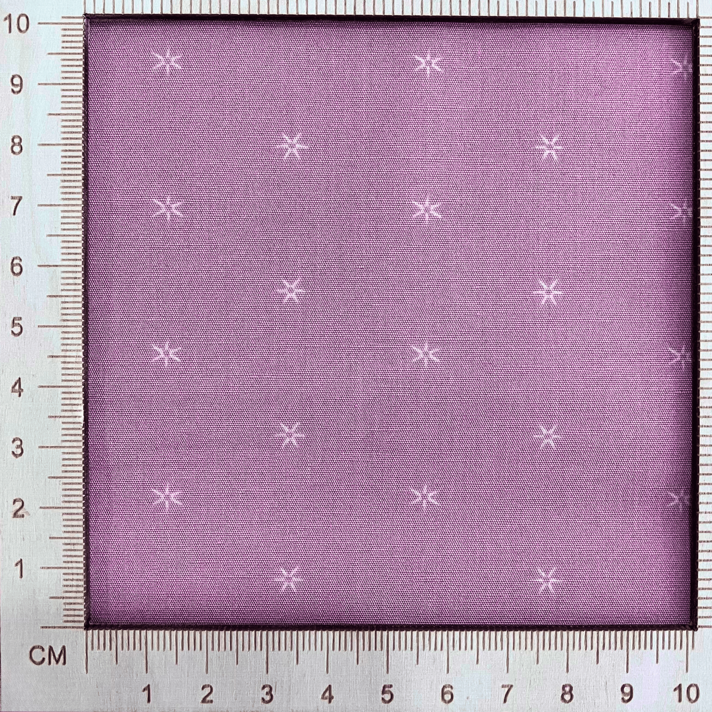 4"x4" scale — 100% cotton quilting fabric — small stars on light grey-pink fabric. 44/45in width.