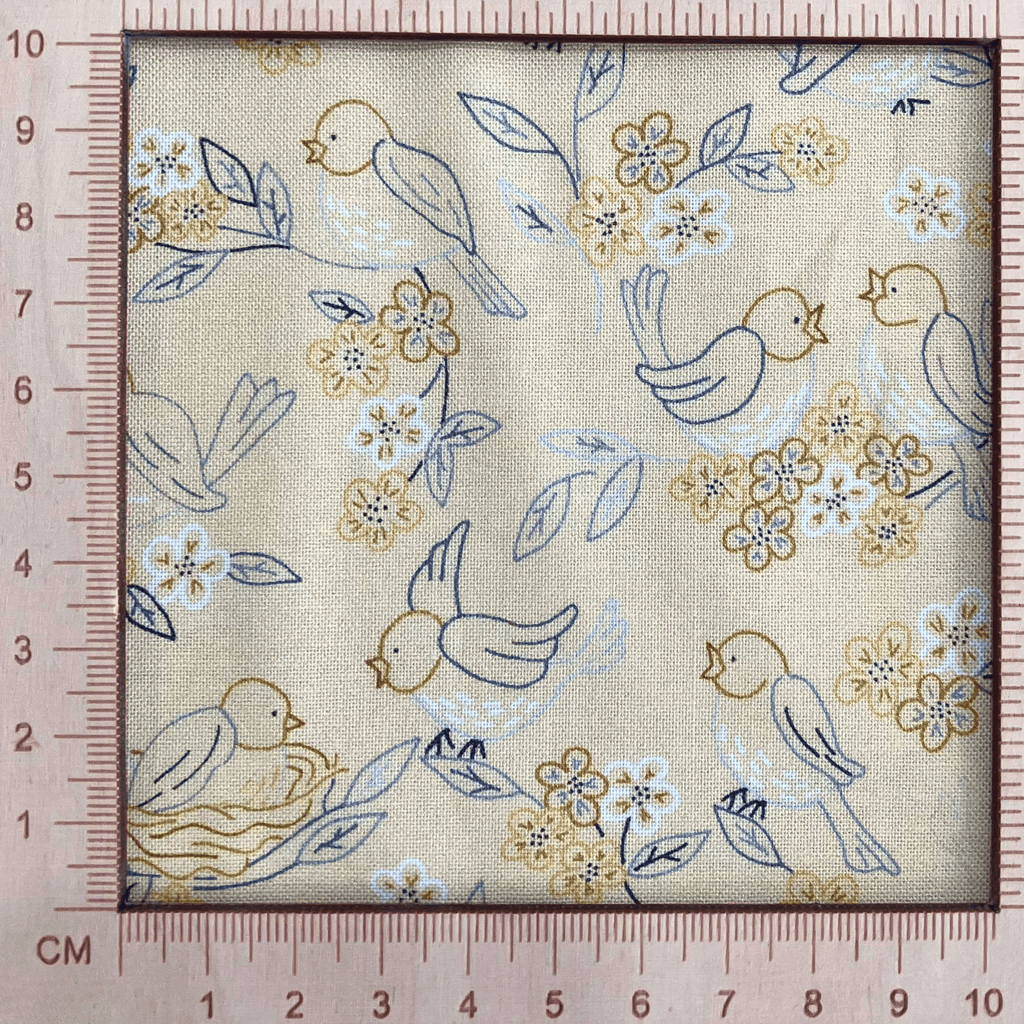 4"x4" scale — 100% cotton quilting fabric — buttery yellow fabric with blue and grey line-drawn birds, nests, and blooms. 44/45in width.