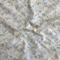 100% cotton quilting fabric — buttery yellow fabric with blue and grey line-drawn birds, nests, and blooms. 44/45in width.