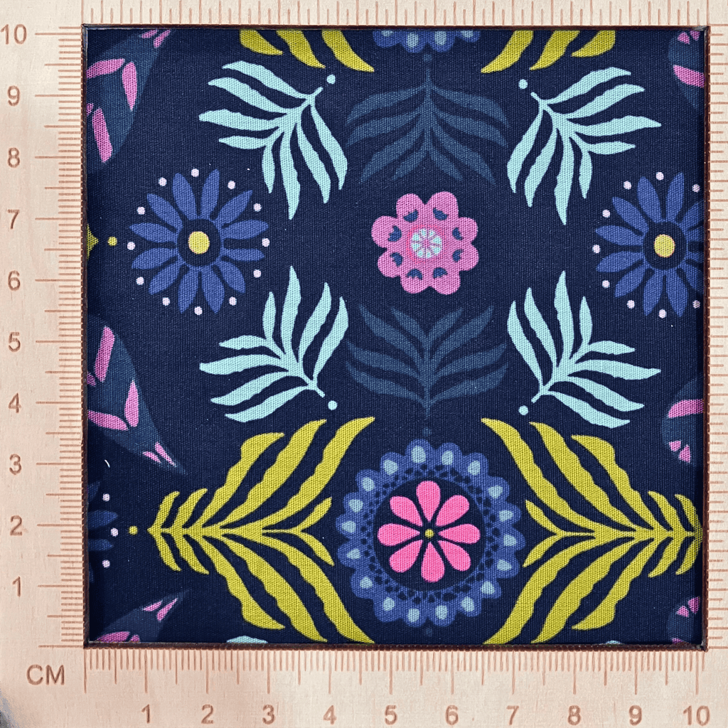 4"x4" scale — 100% cotton quilting fabric — Deep navy fabric with bold florals and leaves. 44/45in width.
