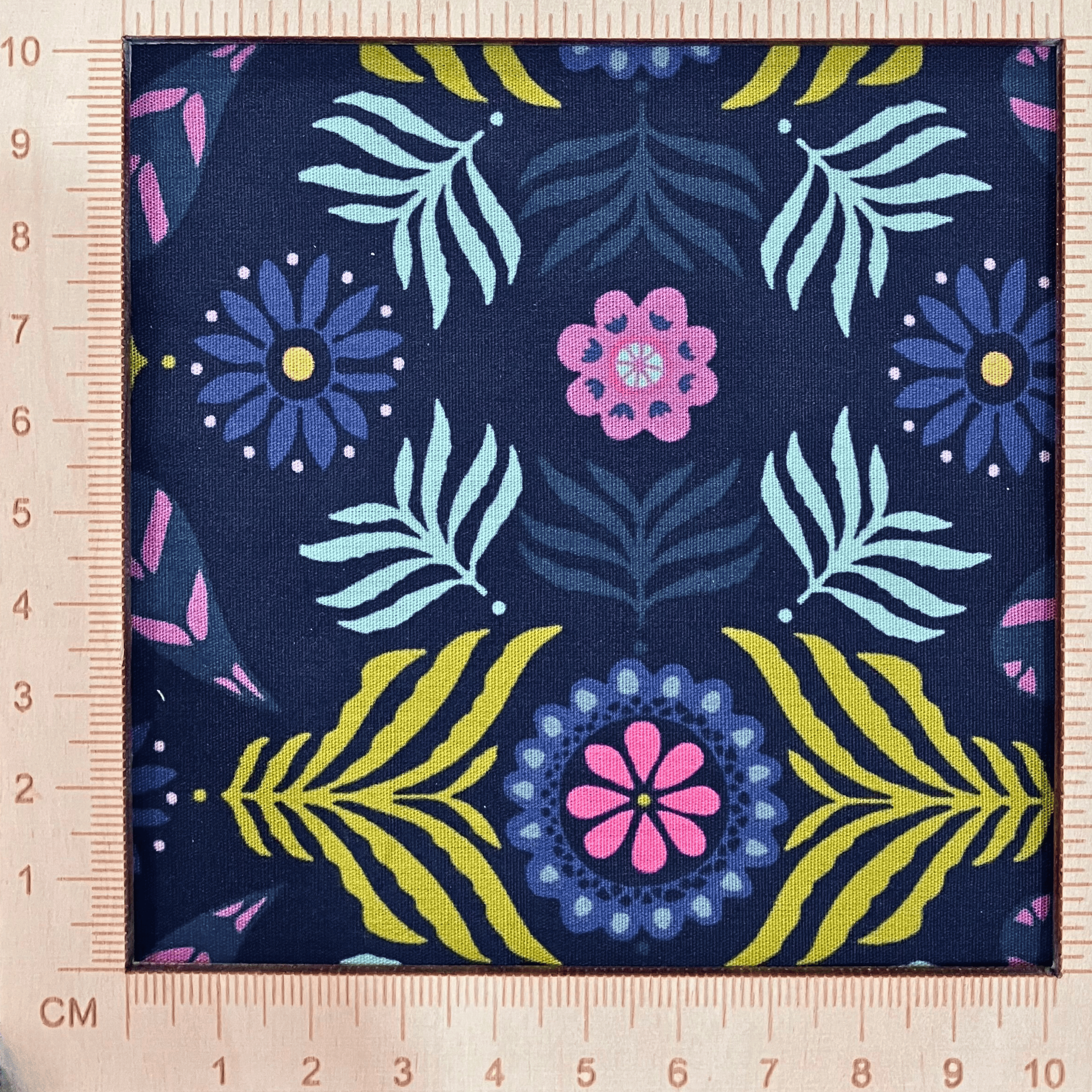 4"x4" scale — 100% cotton quilting fabric — Deep navy fabric with bold florals and leaves. 44/45in width.