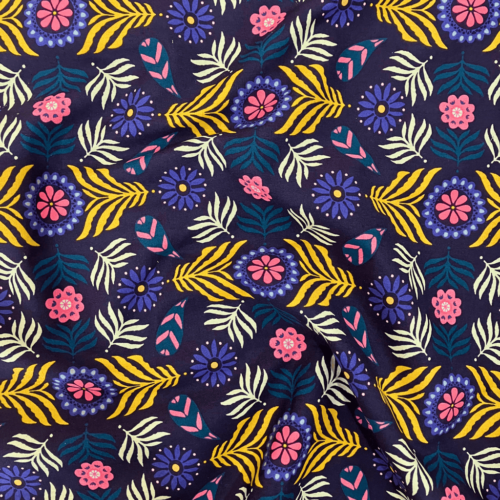 100% cotton quilting fabric — Deep navy fabric with bold florals and leaves. 44/45in width.