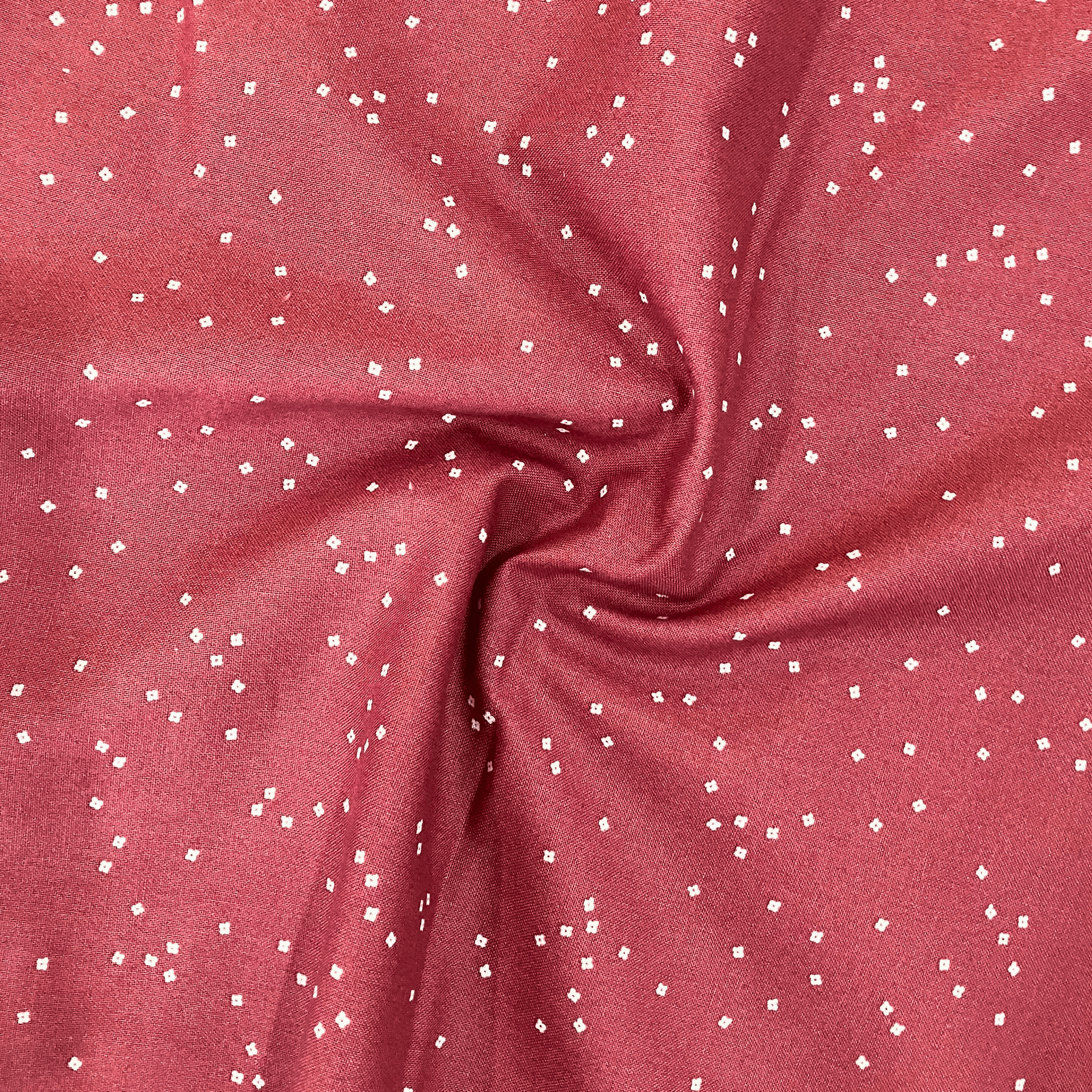 100% cotton quilting fabric — warm red fabric with Tiny white confetti blossoms. 44/45in width.