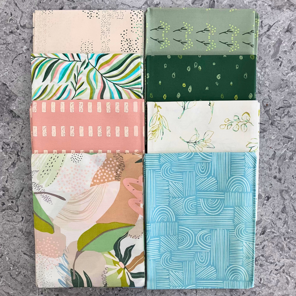 100% cotton quilting fabric — set of eight fat quarters — various fabrics with florals, leaves, and organic textures patterns of soft pinks & greens.