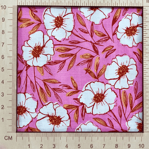4"x4" scale —  100% cotton quilting fabric — pink fabric with white flowers with red & yellow centres. 44/45in width.