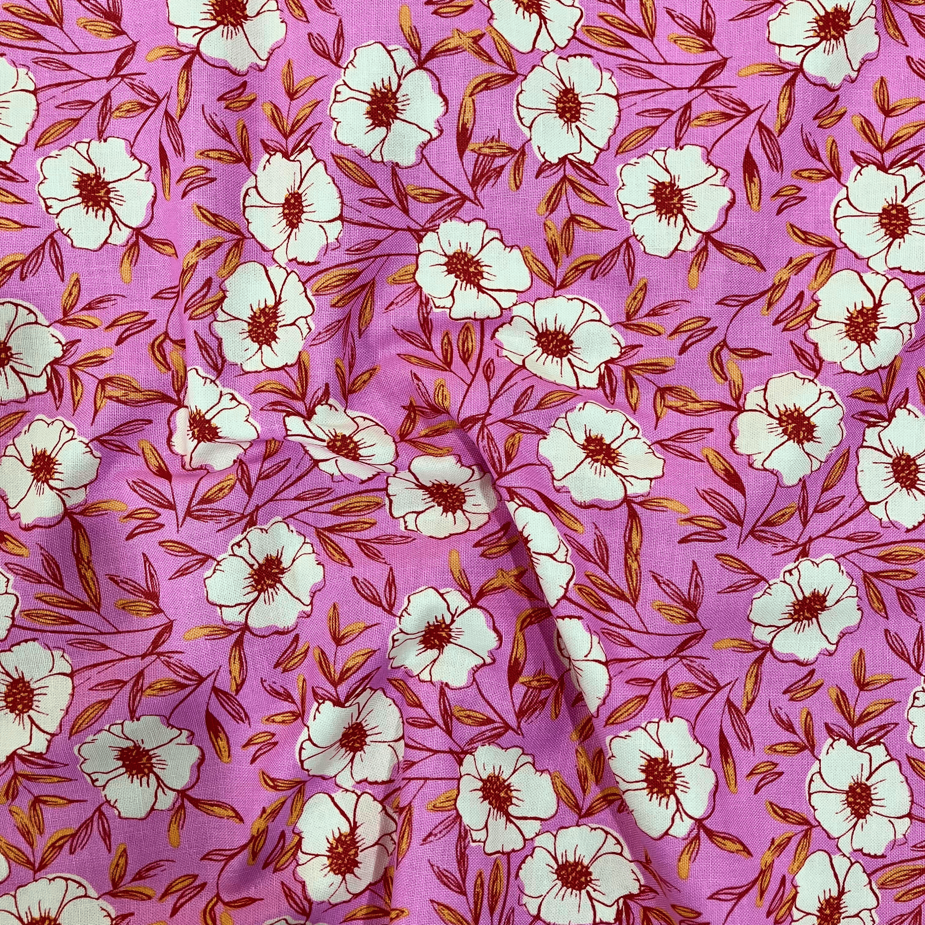 100% cotton quilting fabric — pink fabric with white flowers with red & yellow centres. 44/45in width.