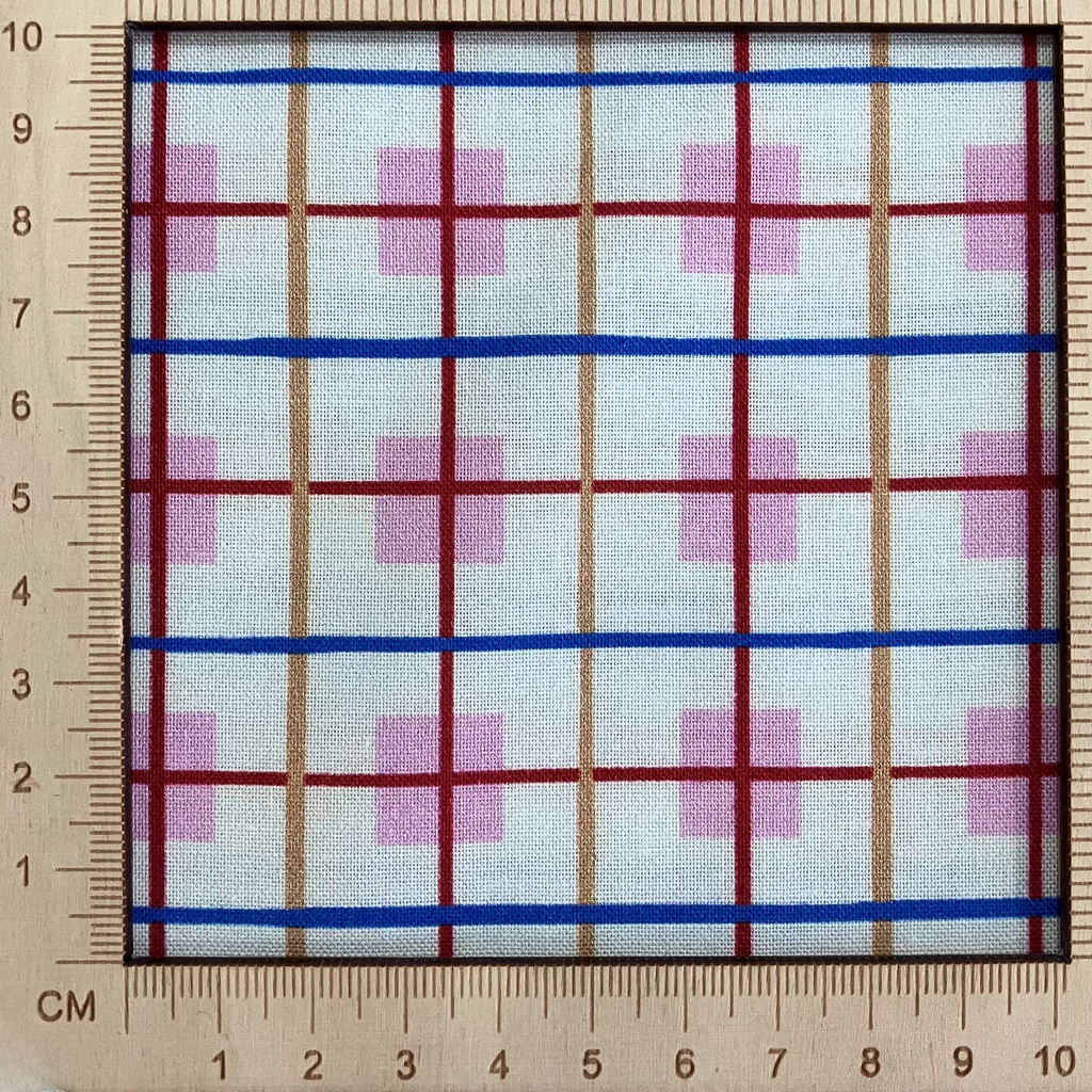 4"x4" scale — 100% cotton quilting fabric — Cream fabric with orange, blue, and red stripes intersect on pink squares. 44/45in width.