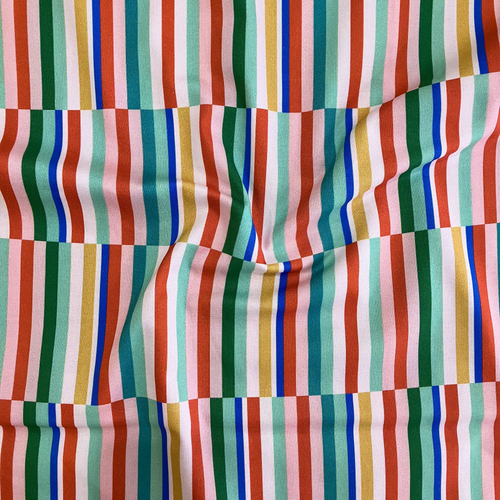 100% cotton quilting fabric — fabric with broken green, blue, orange, and yellow stripes. 44/45in width.