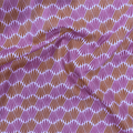 100% cotton quilting fabric — fabric with pink & orange wavy lines. 44/45in width.