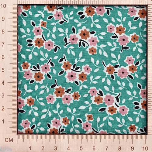 4"x4" scale — 100% cotton quilting fabric — bright green fabric with small pink & orange flowers. 44/45in width.