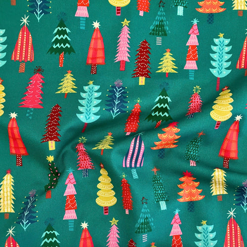 Christmas Trees quilting cotton — illustrated Christmas trees in red, pink, teal, yellow and orange on a bold teal background. Dashwood Studio Candy Cane Christmas collection, 44/45″ wide.