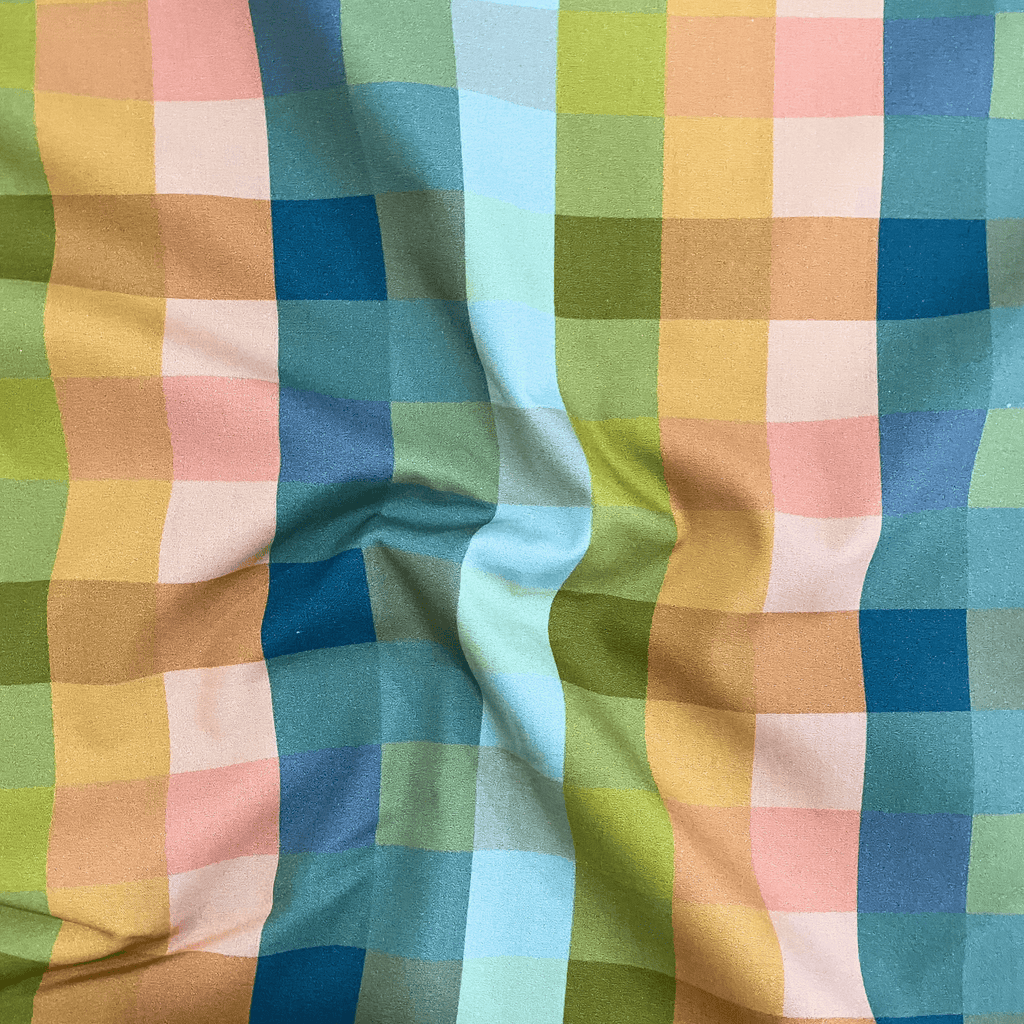 100% cotton quilting fabric — Orange, blue, and green checkered print. 44/45in width.