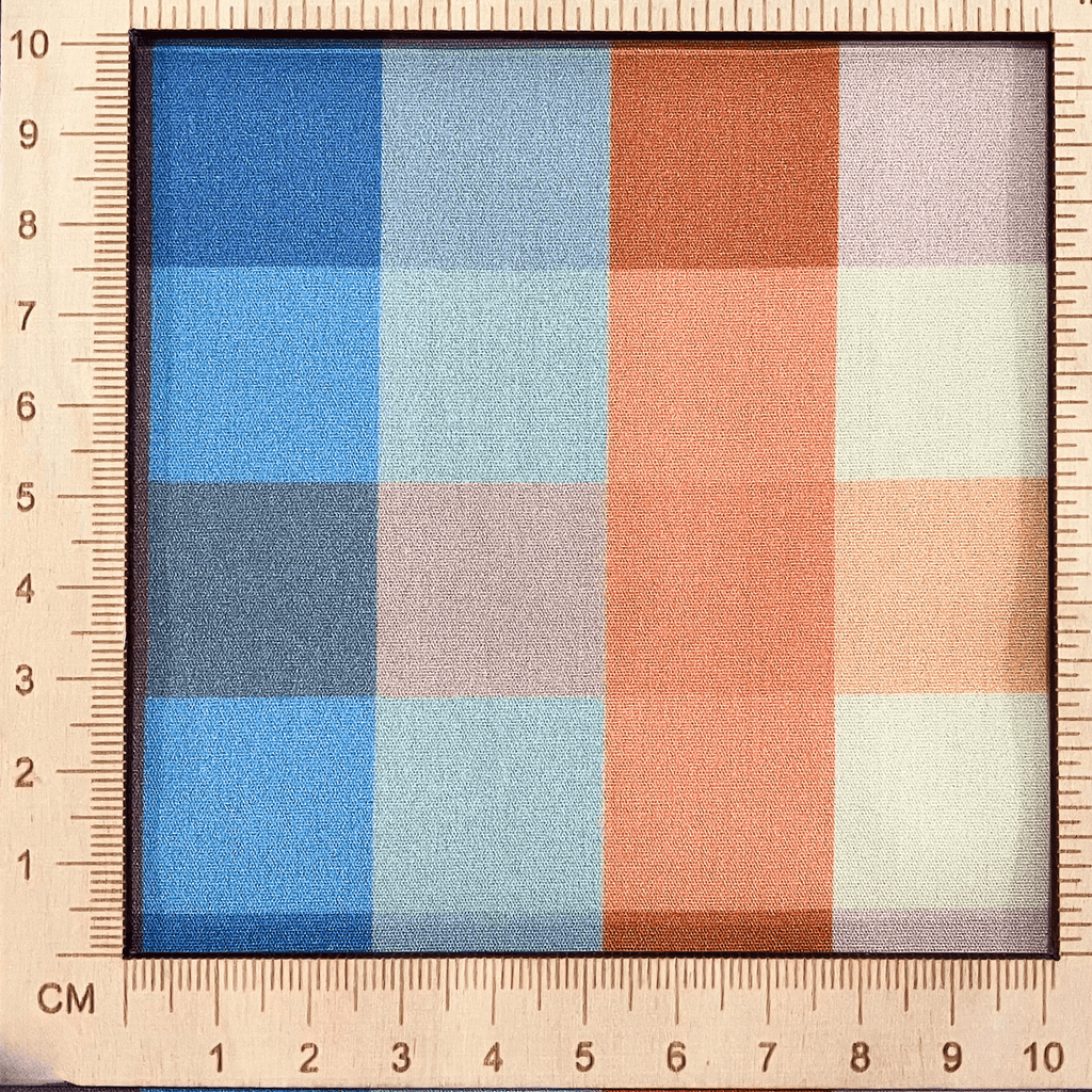 4"x4" scale — 100% cotton quilting fabric — Orange, blue, and purple checkered print. 44/45in width.