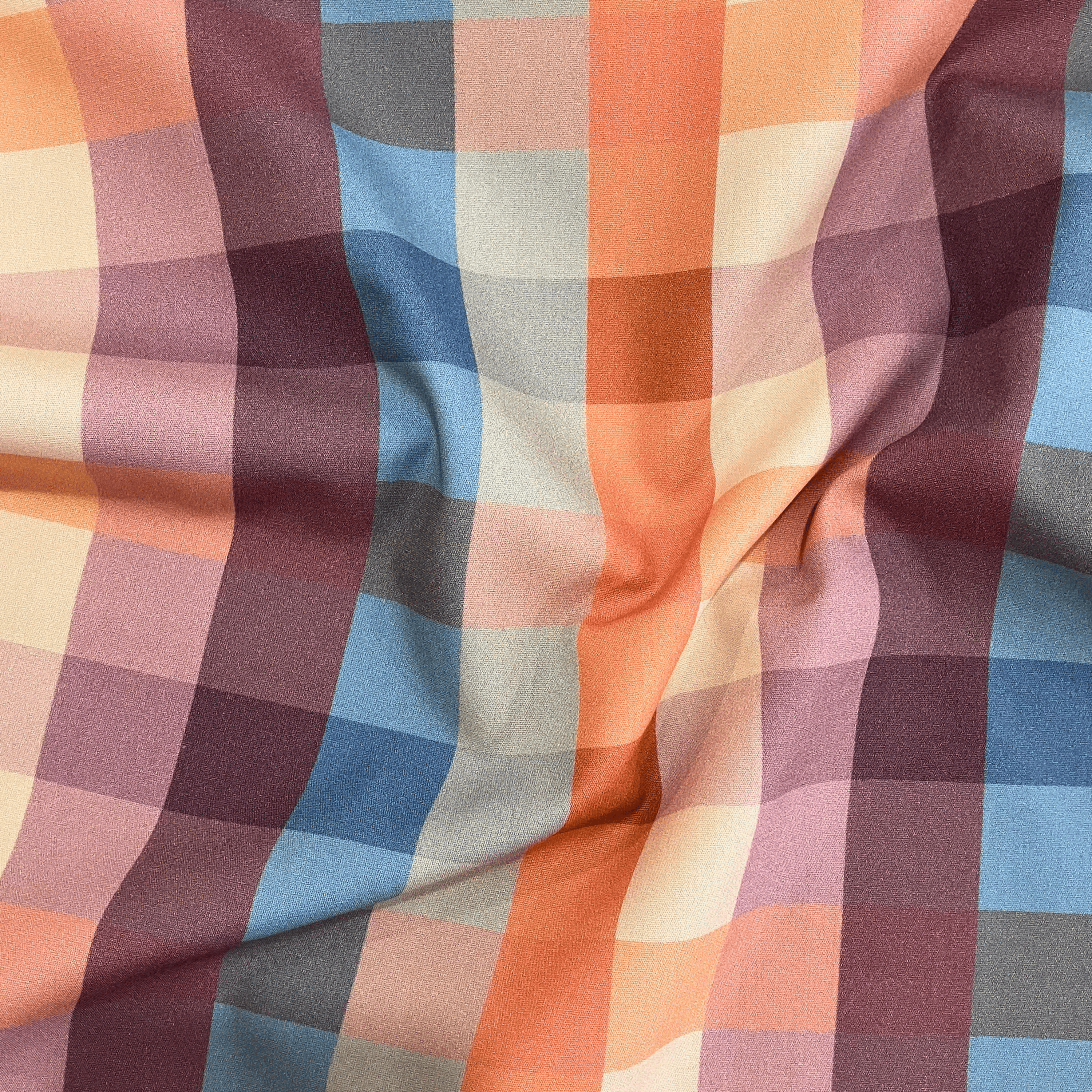 100% cotton quilting fabric — Orange, blue, and purple checkered print. 44/45in width.