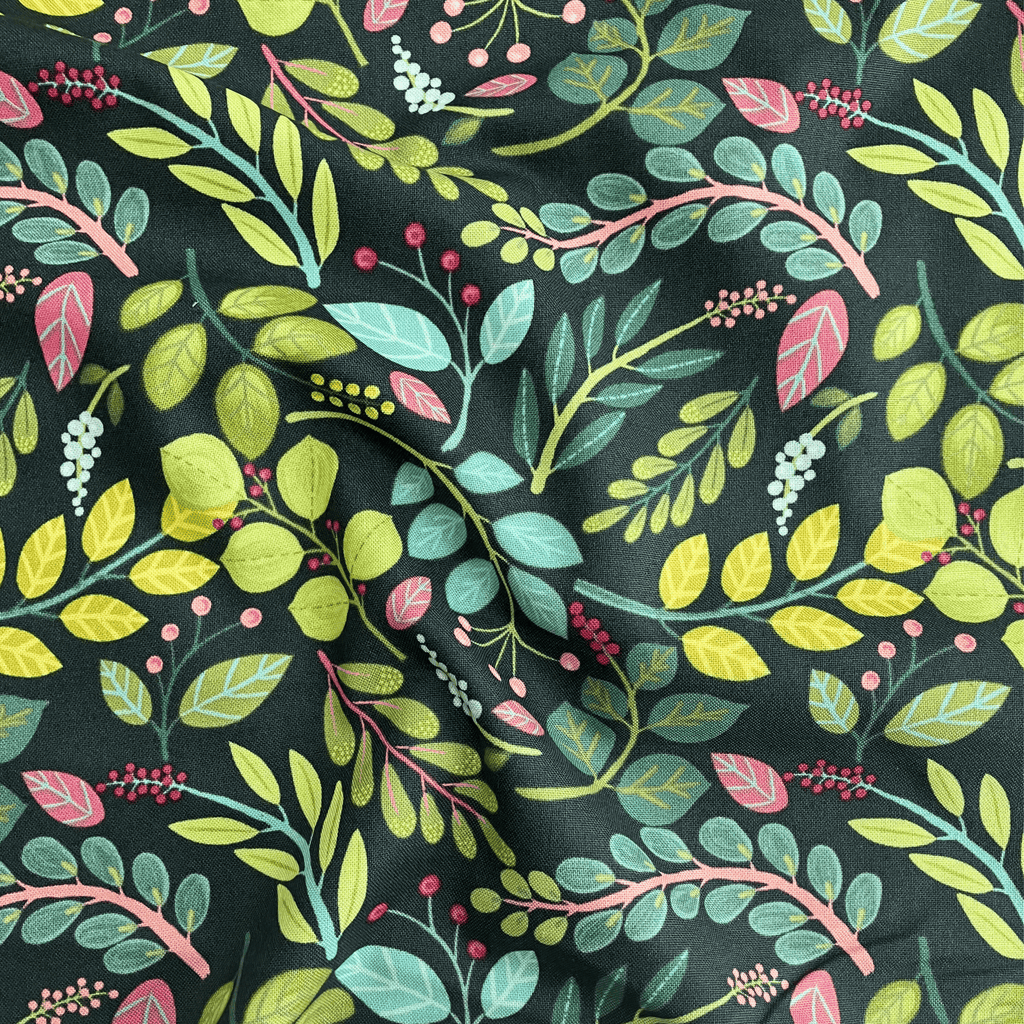 100% cotton quilting fabric — pink, teal & green leaves on dark blue-green. 43/44in width.