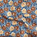 100% cotton quilting fabric — burnt orange & tan flowers with blue-grey leaves on white. 43/44in width.