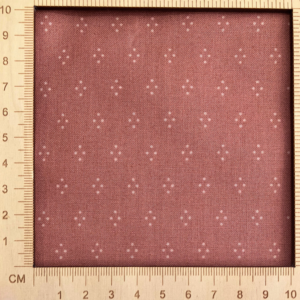 4"x4" scale — 100% cotton quilting fabric — white dot diamonds on muted rose. 43/44in width.