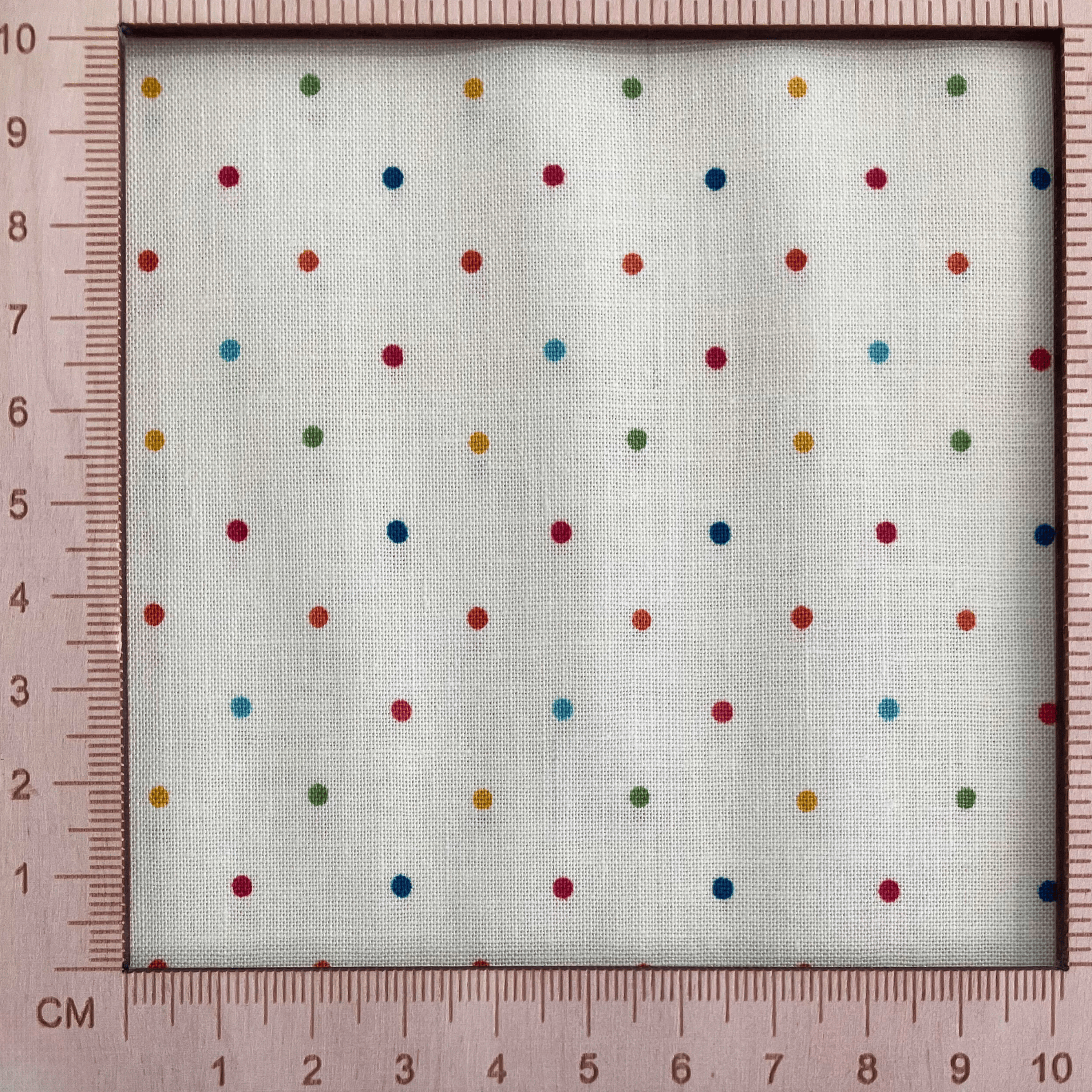4"x4" scale — 100% cotton quilting fabric — multicolour dots on vanilla cream. 43/44in width.