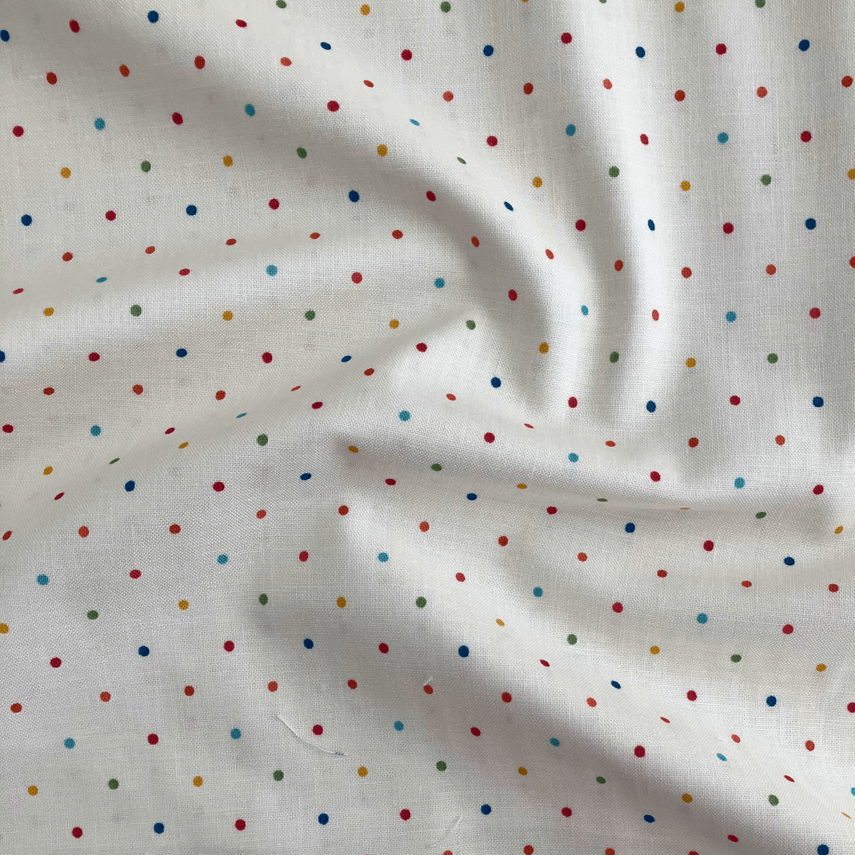 100% cotton quilting fabric — multicolour dots on vanilla cream. 43/44in width.