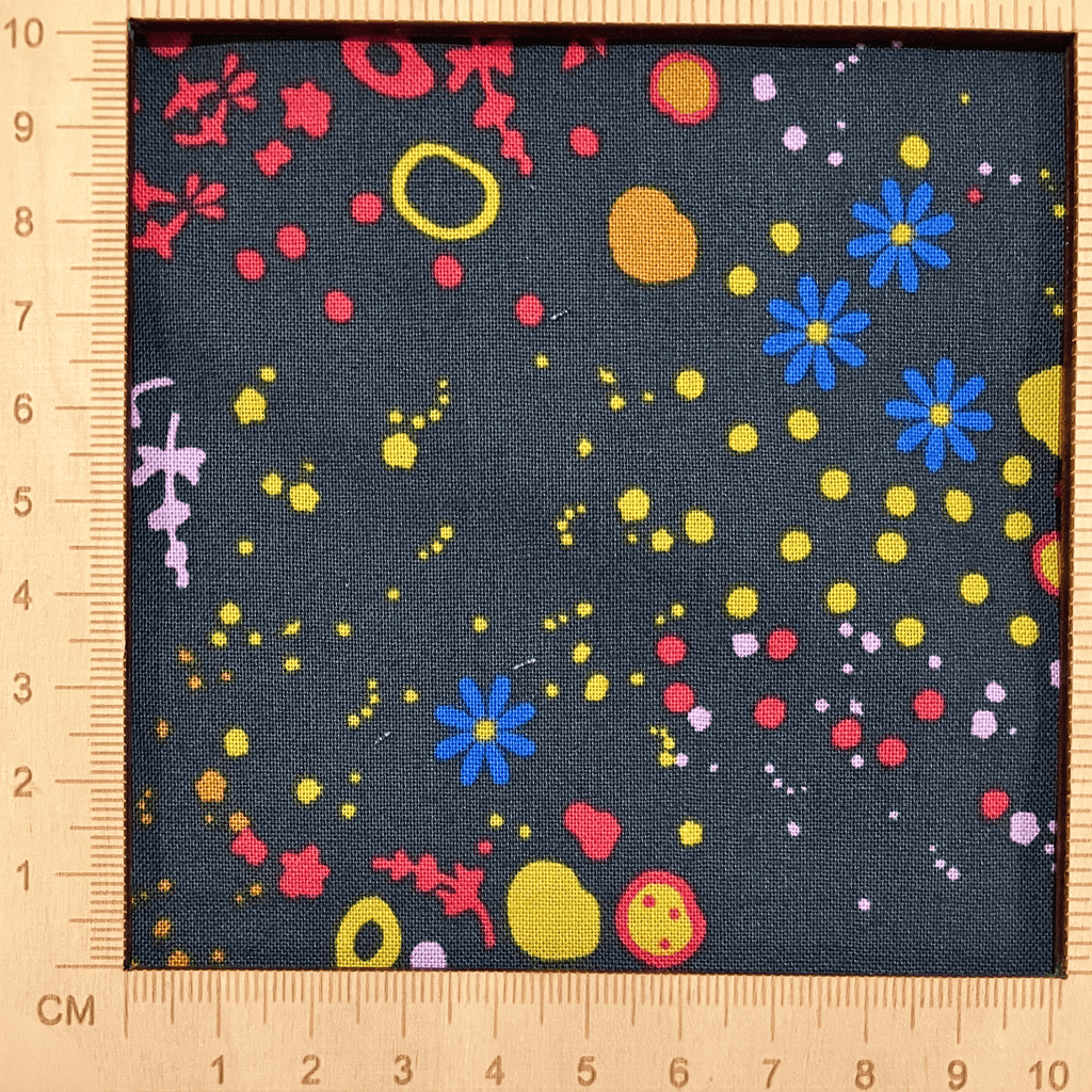 4"x4" scale — 100% cotton quilting fabric — colourful abstract patterns on dark blue-grey. 44/45in width.