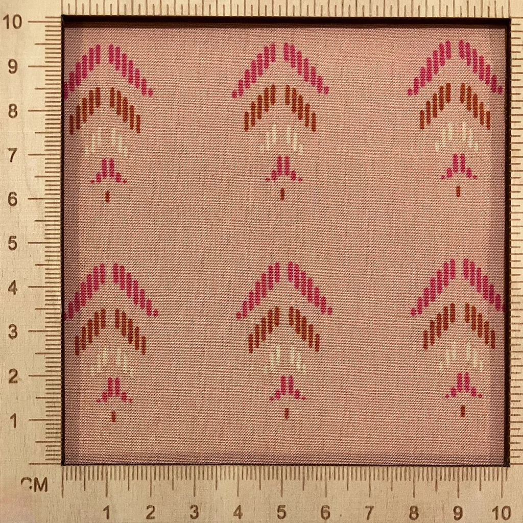 4"x4" scale — 100% cotton quilting fabric — pink & orange feather-like shapes on light coral. 44/45in width.