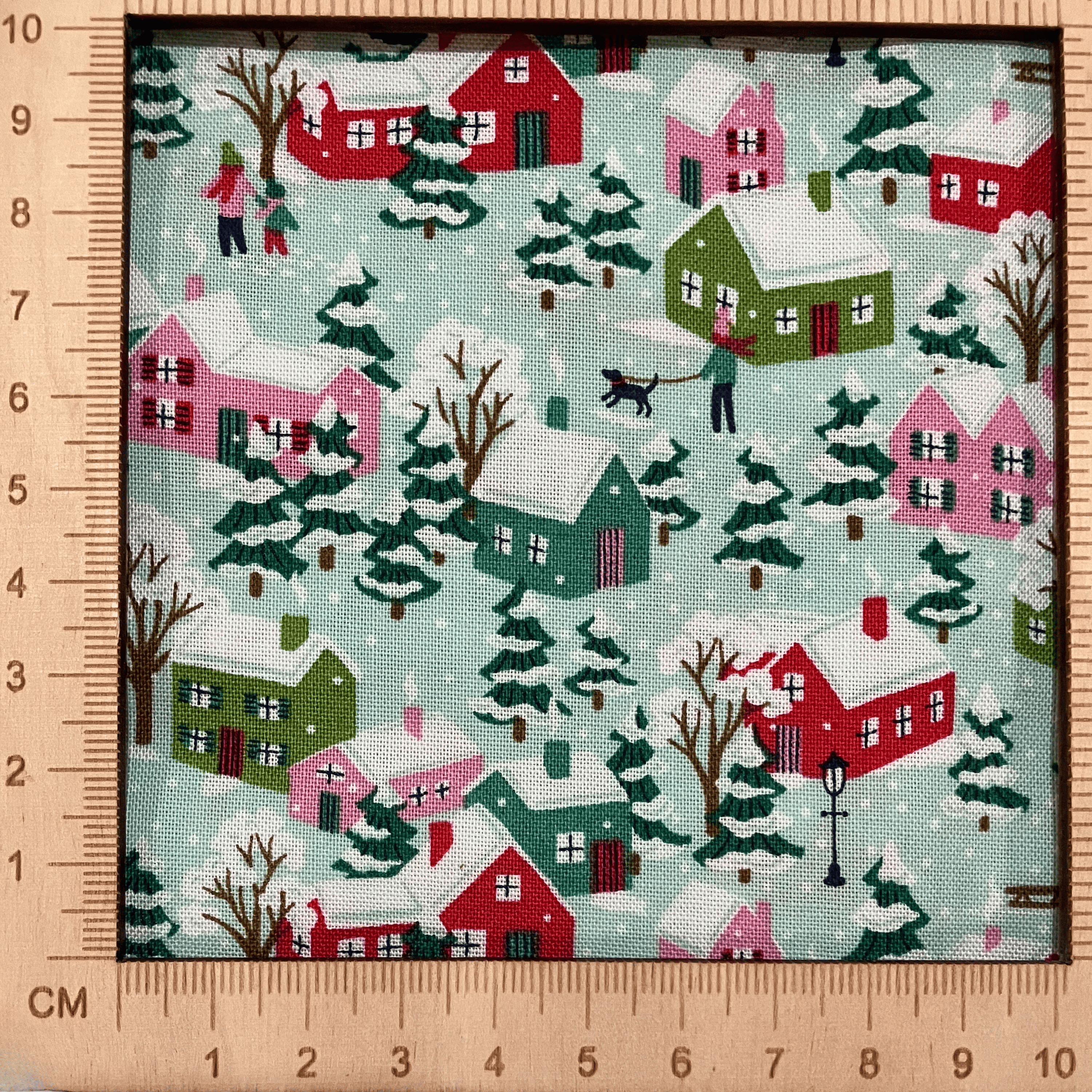 4"x4" scale — Liberty Fabrics Lasenby cotton — snow-covered houses & trees in a winter village scene. 44/45in width.