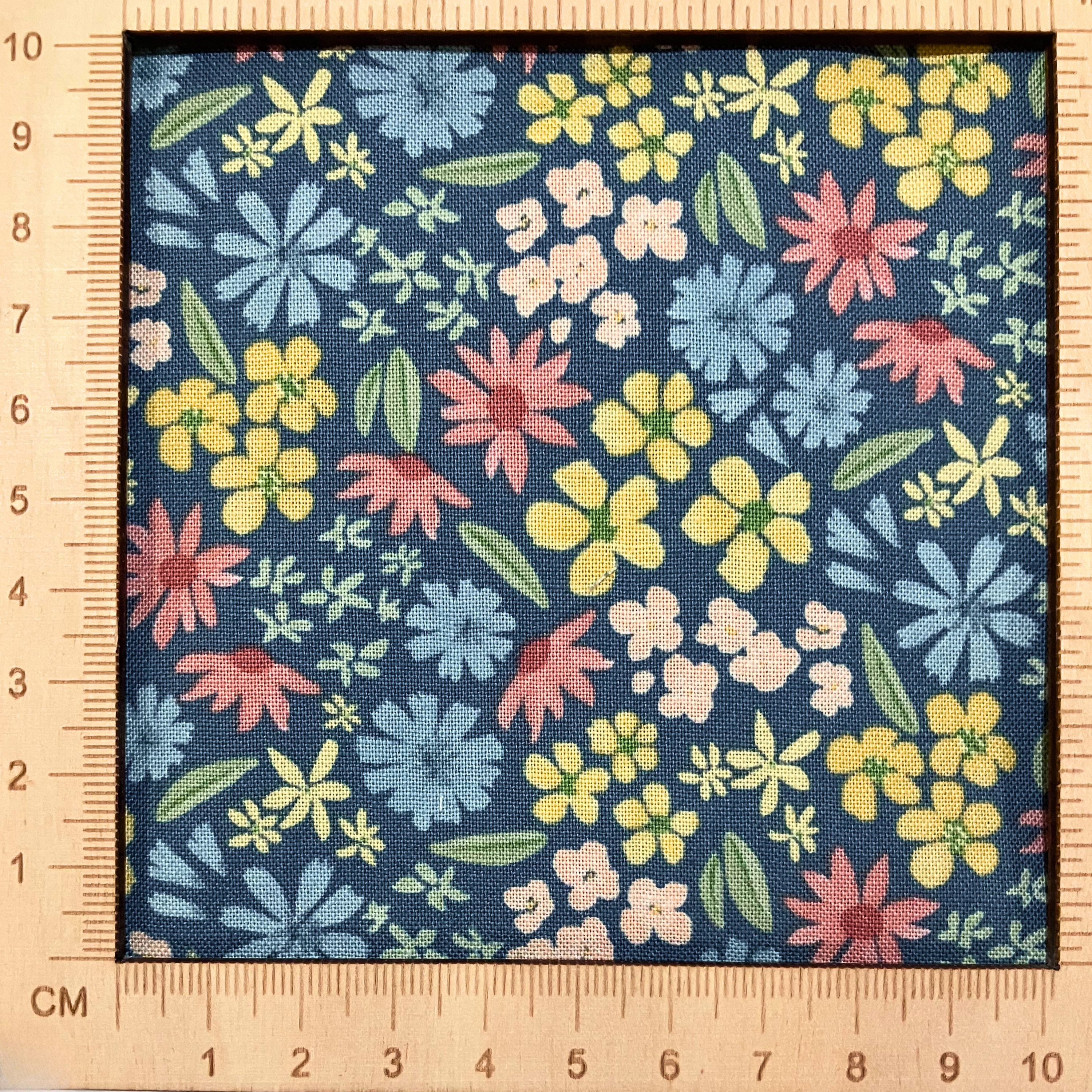 4"x4" scale — 100% cotton quilting fabric — Colourful floral pattern on blue. 43/44" width.