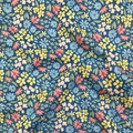 100% cotton quilting fabric — Colourful floral pattern on blue. 43/44in width.