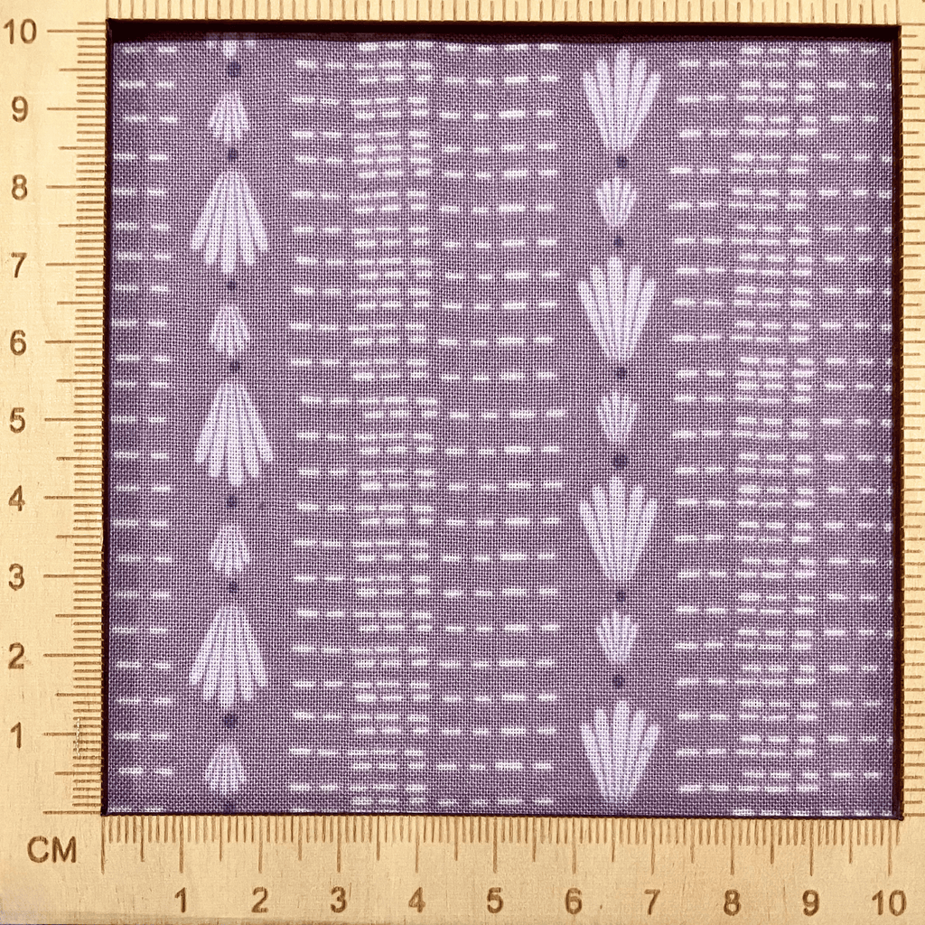4"x4" scale — 100% cotton quilting fabric — repeated shell & dash lines on grey-purple. 44/45in width.