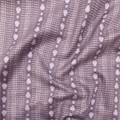 100% cotton quilting fabric — repeated shell & dash lines on grey-purple. 44/45in width.