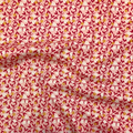 100% cotton quilting fabric — small white & orange flowers on light coral. 43/44in width.