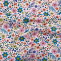 100% cotton quilting fabric — colourful floral pattern on a pale pink. 43/44in width.