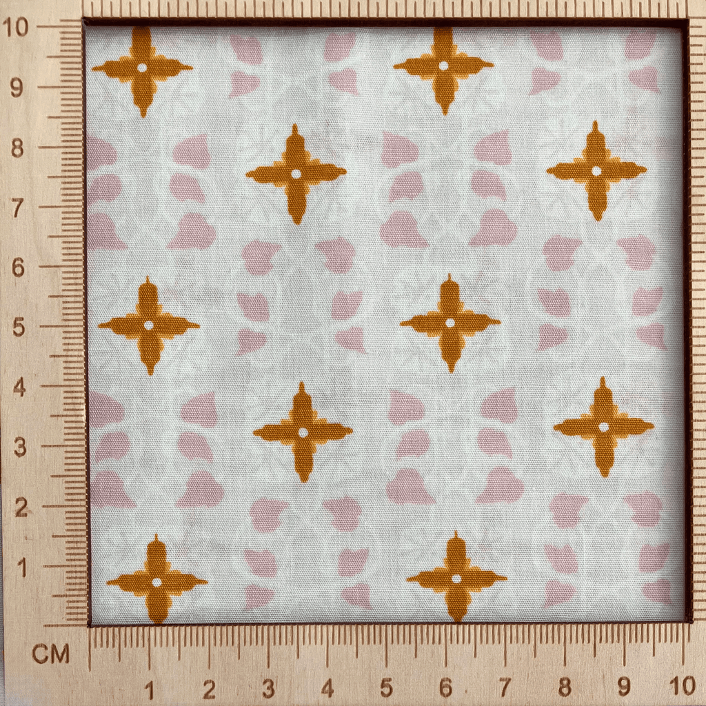 4"x4" scale — 100% cotton quilting fabric — geometric mosaic-inspired pattern on cream. 44/45in width.
